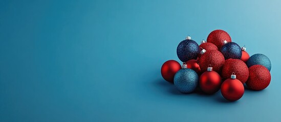 Poster - Colorful Christmas ornaments on a blue background ideal for festive messages and holiday greetings