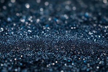 Poster - Beautiful sparkling blue glitter scattered across a dark background, creating a mesmerizing texture that enchants the viewer with its shimmering reflections and ethereal allure.