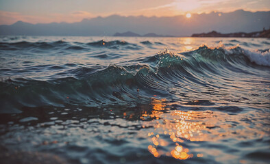 Poster - The ocean is calm and the sun is setting. The water is a deep blue color. The waves are small and gentle