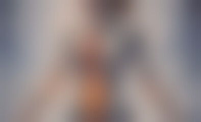 Poster - blurry image of a woman. the woman is wearing a black shirt and has a tan colored body