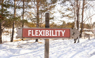 Wall Mural - Flexibility symbol. Concept word Flexibility on beautiful wooden road sign. Beautiful winter forest background. Business flexibility concept. Copy space.