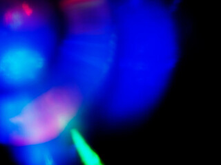Wall Mural - a colorful, blurry background with a rainbow of colors. the colors are bright and vibrant, creating 