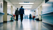 © janzwolinski - Medical staff walking down hospital corridor