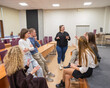 © Михаил Решетников - Young people communicate in sign language in a university classroom.