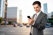 © BillionPhotos.com - Portrait of smiling ceo manager using smartphone