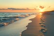 © Nikolai - Golden sunset at beach with footprints in sand and waves