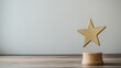 © Elkhan Babayev - A golden star trophy sits on a wooden table against a white background, leaving ample space for your own words. This symbol of success and accomplishment signifies reward and victory.