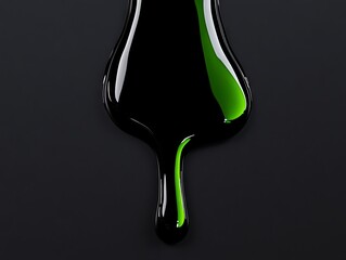 Wall Mural - A black and green liquid dripping down from a bottle