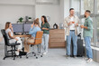 © Pixel-Shot - Technical support agents talking during break in office