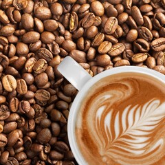 Wall Mural - Cup of tasty hot coffee and coffee beans on desk