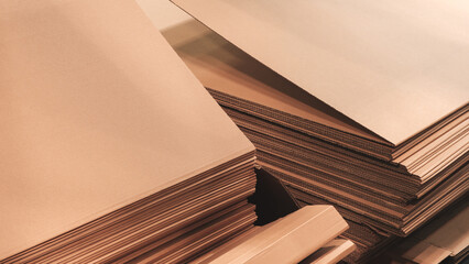 Poster - A stack of cardboard boxes with a brown color. The boxes are piled up on top of each other