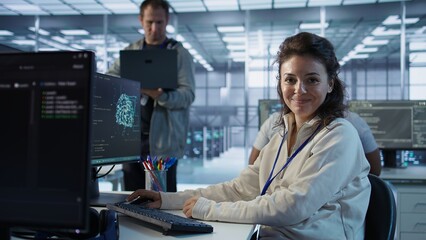 Poster - portrait of upbeat woman working in high tech ai facility providing computing resources for differen