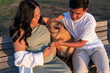 © Christine La/Stocksy - Expecting asian couple dog