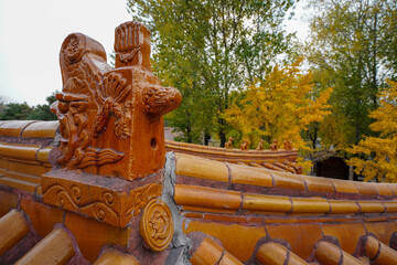 Wall Mural - Yellow Chinese glazed roof tile dragon head architecture of Huangtangzi, Manchu Museum, China Ethnic Museum