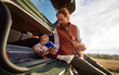 © Boris Jovanovic/Stocksy - Adorable toddler enjoying a picnic with her father