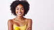 © Rashid - a woman with a yellow top with her arms crossed.