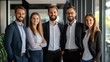 © khonkangrua - Group of Young Professionals Smiling in Modern Office Environment with Natural Light and Clean Design
