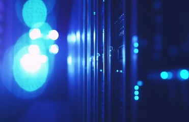 Poster - Futuristic Data Center with Glowing Server Racks and Blue LED Lights Creating a High-Tech Atmosphere for Digital Connectivity and Network Management