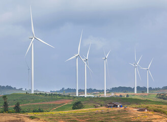 Wall Mural - wind turbines generating electricity in power station on blue sky ,ecology concept.