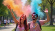 © Olga Nevskaya - Joyful celebration of Holi with vibrant colors and laughter in a lively park setting