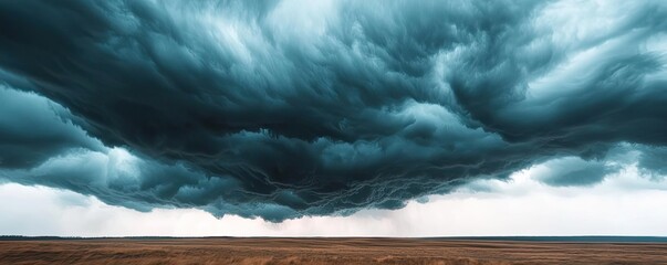 Poster - Dramatic storm clouds loom over a vast landscape, creating an intense atmosphere.