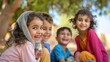 © Marzuki - Four joyful children smiling outdoors under a tree.