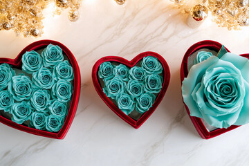 Wall Mural - blue roses in a red heart-shaped box