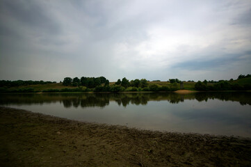 Wall Mural - A small river on a cloudy day