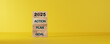 © phimprapha - Implementation of the 2025 goal plan. Starting a business. New Year. Place the last piece of the wooden cube with the letters 2025. The steps necessary to achieve the goal.