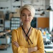 © visoot - Women, a boss with a blond short haircut, in an office, holding many presentations and calendars, with a beautiful stand with drones in the background.