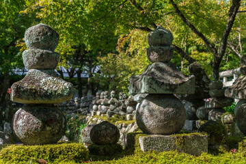 Wall Mural - Japanese type of Buddhist pagoda (gorinto) in the form of a structure of five stones of various shapes on the territory of the Buddhist temple of Adashino Nenbutsuji, Kyoto, Japan