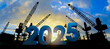 © Yingyaipumi - New year 2025 concept,Silhouette construction site,Cranes building construction prepare to welcome the new year 2025 at sunset.