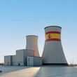 © VITALII - Nuclear power facility with flag of Spain and blue sky.