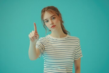 Poster - A woman in a striped t-shirt points at the camera, a simple yet powerful gesture