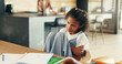 © peopleimages.com - Girl, child and sick of stomach ache in home with homework, belly discomfort and tummy virus. School project, student and uncomfortable with constipation, abdominal inflammation and health problem