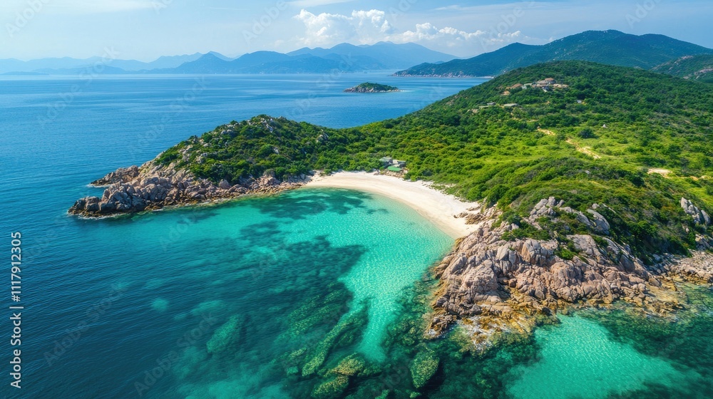 Aerial view of secluded tropical beach with turquoise water, white sand, and lush green hills.