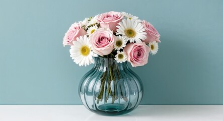 Wall Mural - A modern glass vase with an elegant design holding a bouquet of soft pink roses and white daisies set against a plain teal background