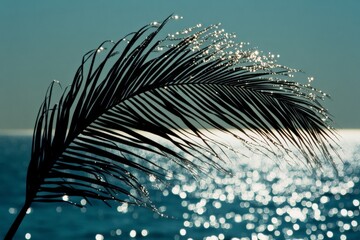 Aufkleber - The sunlit water creates a mesmerizing scene with a palm leaf silhouette, emphasizing the beauty and tranquility of a peaceful, tropical setting by the sea.