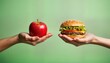 © miss irine - Hands hold apple, burger. Healthy choice vs unhealthy food. Comparison of diet. Fresh fruit, fast food. Balanced eating habits. Lifestyle choice. Nourishment. Vegetarian option. Non vegetarian