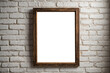 © eman - rustic wooden frame hanging on a white brick wall.