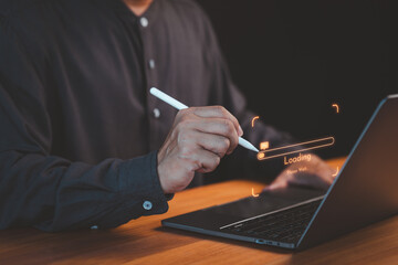 Poster - Close-up of a person using a pen with a laptop, highlighting a glowing loading bar and digital interface, representing technology, progress, and innovation.