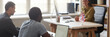 © Seventyfour - Website header shot of young African American man using laptop with white black screen in English class talking to teacher, while sitting at desk in language course group