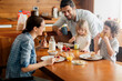 © Geber86 - Happy family enjoying breakfast together in a cozy kitchen