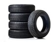 © Konstantin Sigaev - A clean stack of black rubber tires is reflected isolated on white background, showcasing their tread patterns. Perfect for automotive, transportation, or tire-related themes and promotions.