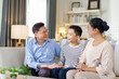 © DG PhotoStock - Asian family in living room