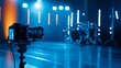 © Fareedoh - Close-up of camera on tripod capturing a modern music studio with blue lighting and drum set in the background.