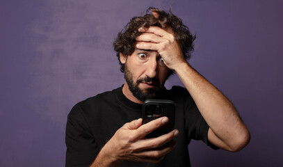 Poster - young bearded crazy man with a smartphone