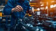 © Pixcellence - Close-up view of a mechanic working on a car engine in a workshop. The image shows the intricate details of the engine and the tools being used for repair and maintenance.