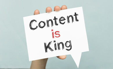 content is king message on the card shown by a man