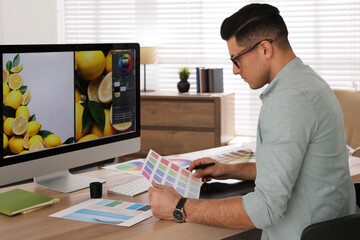 Poster - Professional retoucher working on computer in office